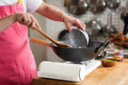 Kenji López-Alt uses his Earlywood wok spatula while cooking
