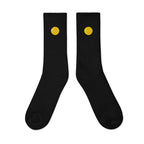 Crew socks, outside view, black, "Egg Yolk" embroidery on both socks