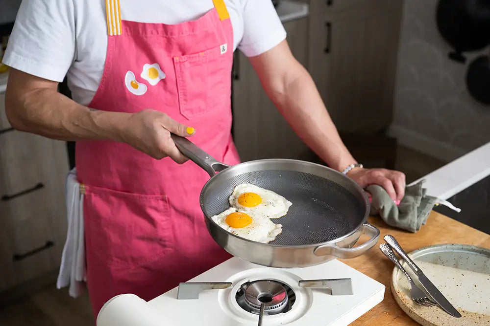 Kenji López-Alt wears his pink Hedley & Bennett collaboration apron