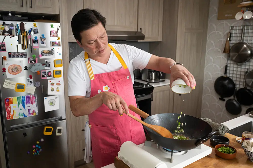 Kenji López-Alt wears his pink Hedley & Bennett collaboration apron