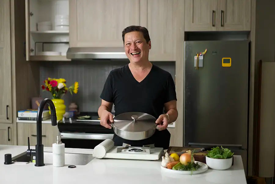Kenji López-Alt poses with his new Our Place Braiser collaboration product