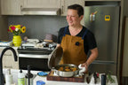 Kenji López-Alt poses with his new Our Place Braiser collaboration product