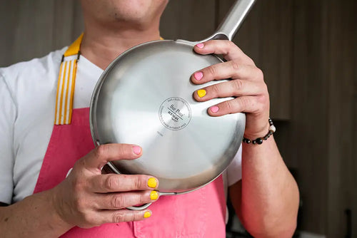 Kenji López-Alt poses with his Our Place Titanium Pro Pans