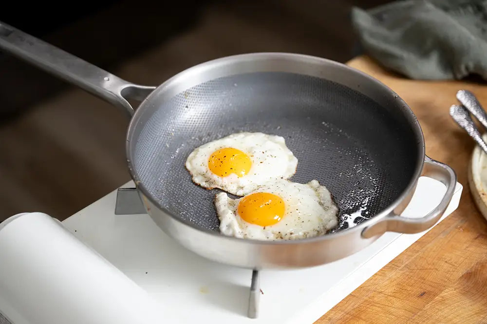 Kenji López-Alt uses his Our Place Titanium Pro Pans to cook fried eggs