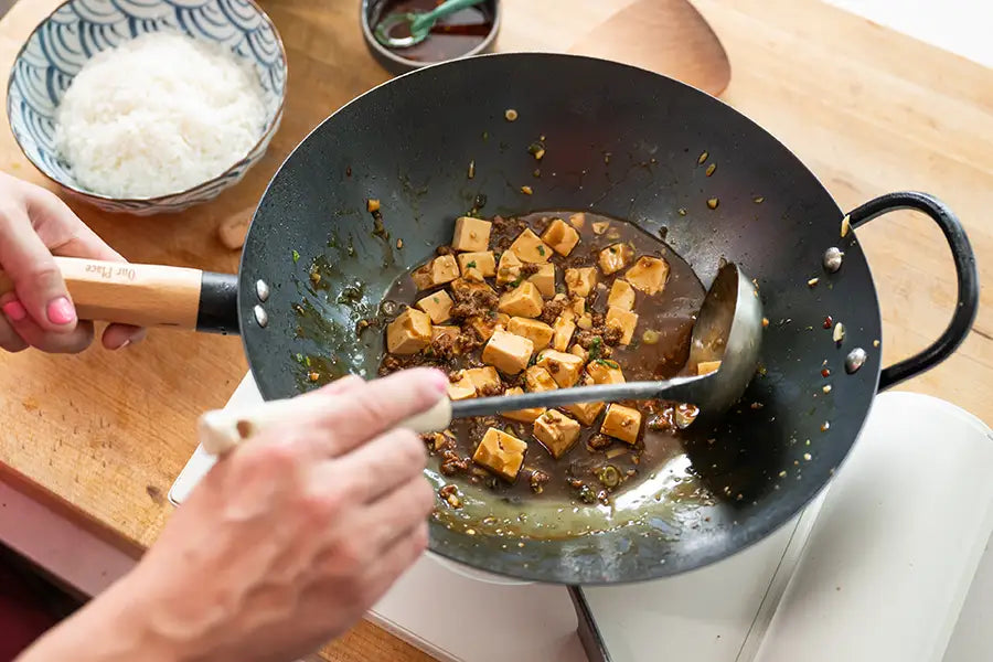 Kenji López-Alt cooks mapo tofu in his Our Place wok collaboration
